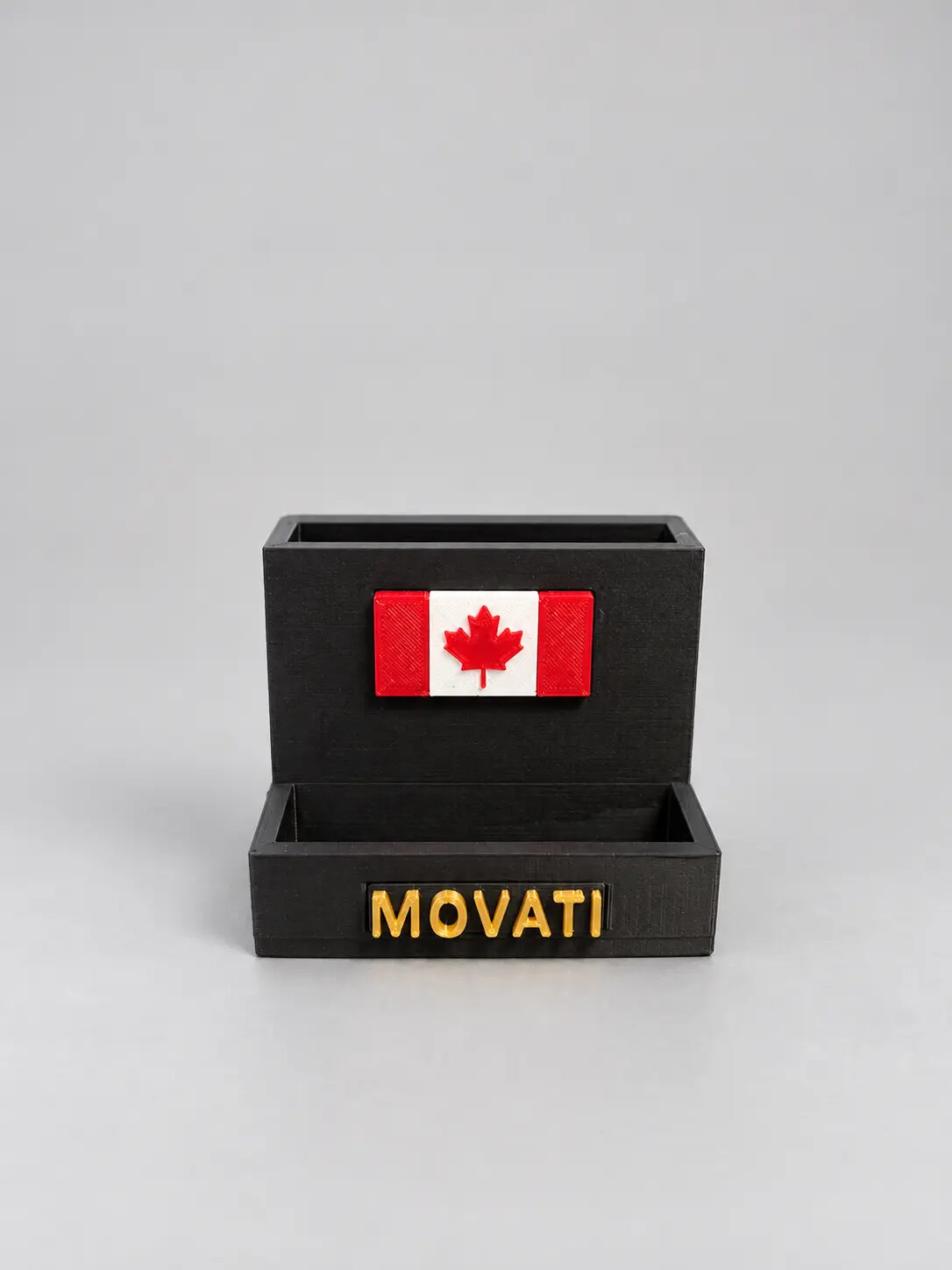 Black 3D printed desk organizer with Canadian flag and gold lettering